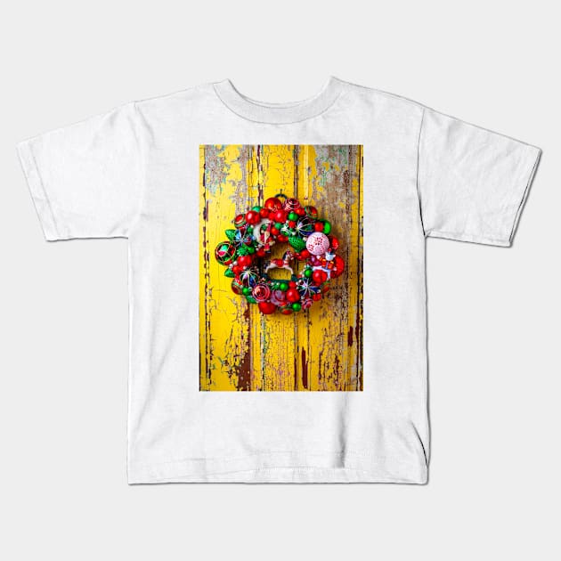 Vintage Christmas Wreath On Yellow Door Kids T-Shirt by photogarry